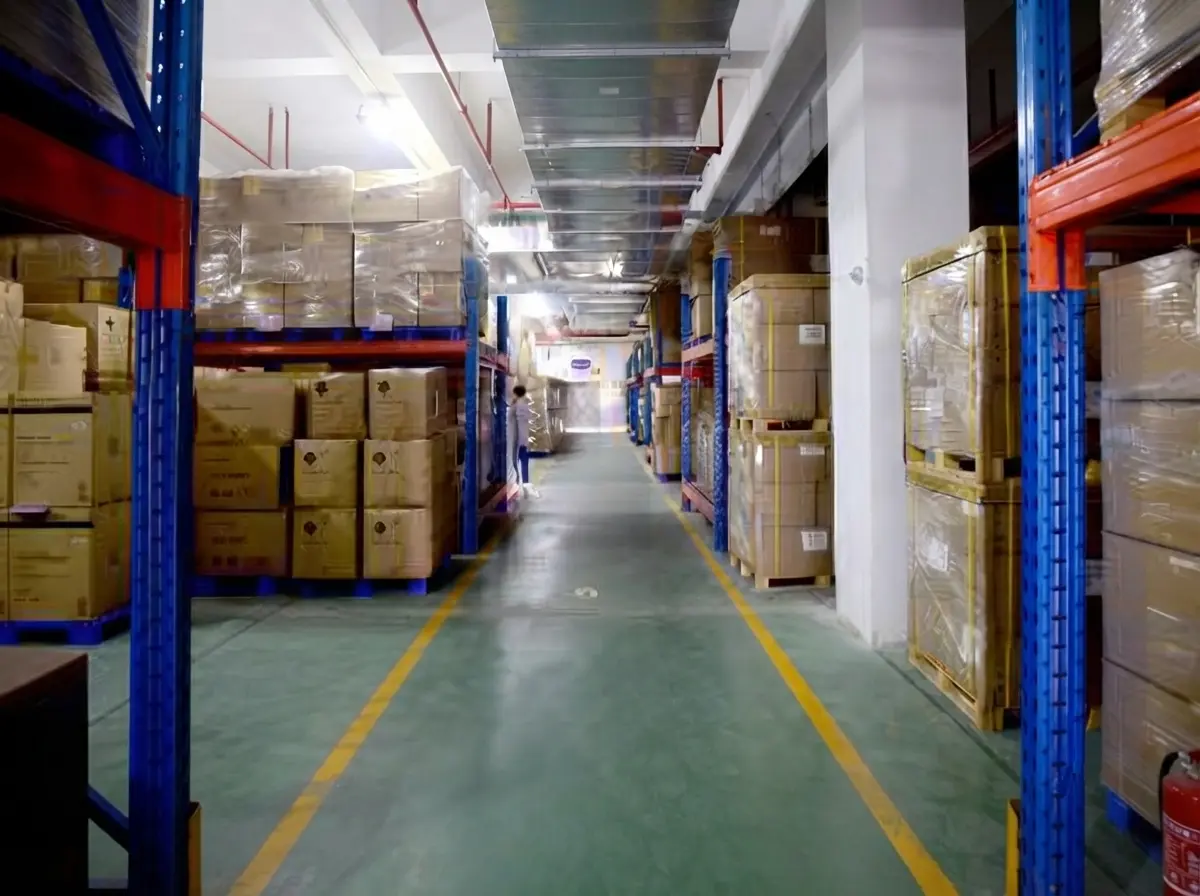 Warehouse storage area at HG Pickleball’s China facility with shelves and cartons for OEM/ODM pickleball and sports bags